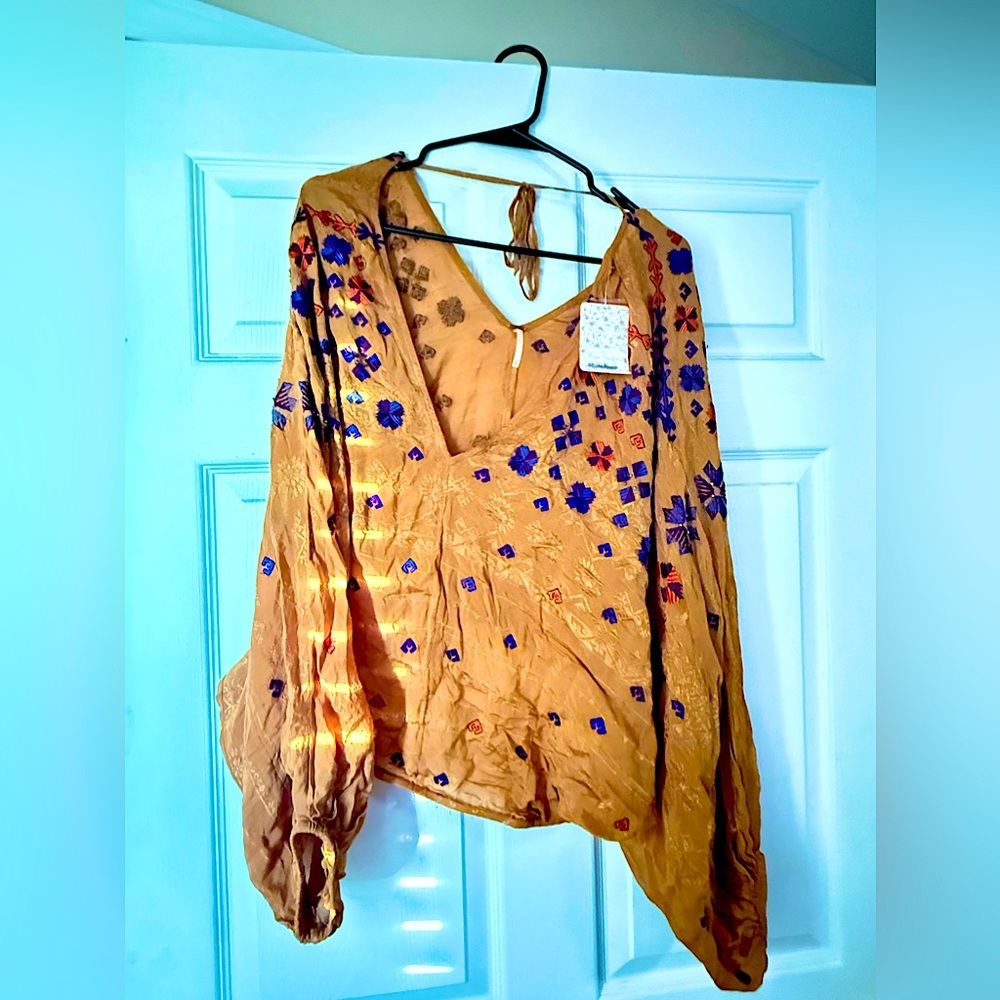 Free People top never worn tags still attached.